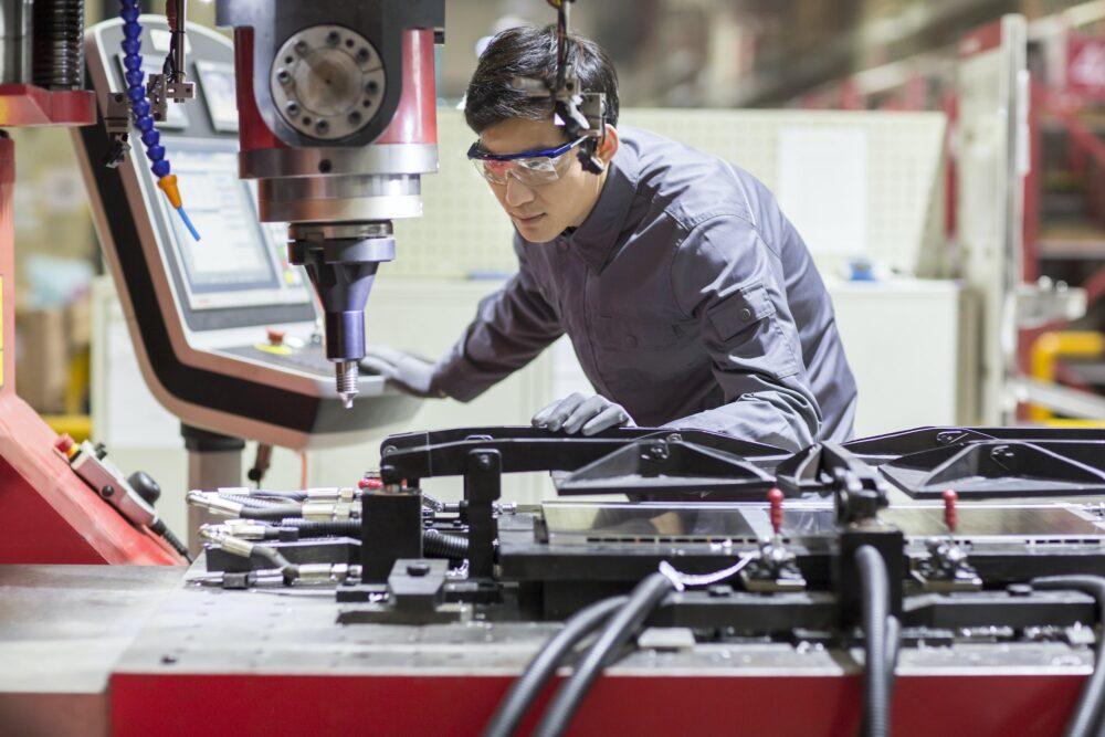 Young engineer working in the factory